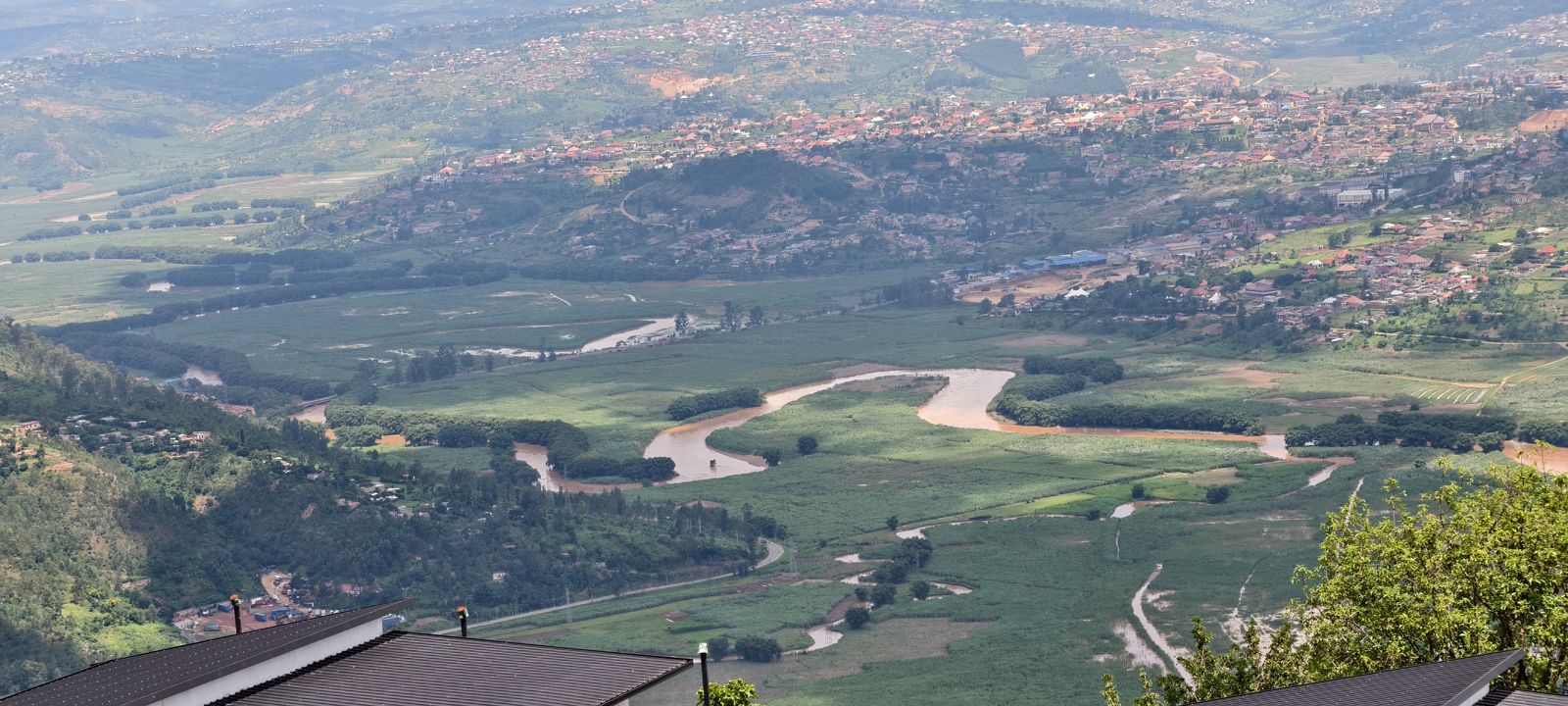 The Nyabarongo river winding through the valley below the ridge